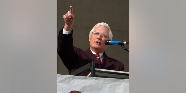 Former Jefferson County and District Court Judge Michael O'Connell gestures towards the Jefferson County Courthouse during a rally Sunday April 24, 2005 at in Louisville, Ky. The rally was held to counter the Justice Sunday rallies held today. (AP Photo/Timothy D. Easley)