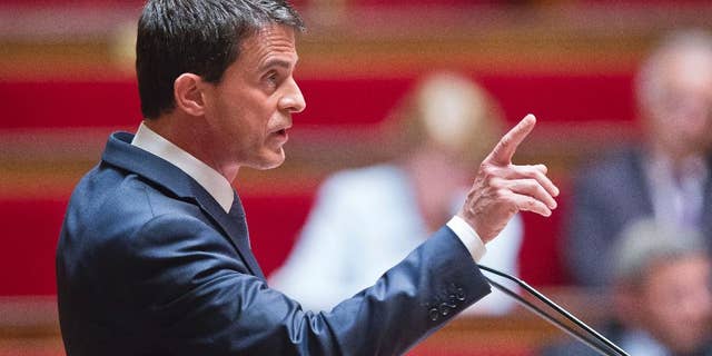 French Prime Minister Manuel Valls delivers a speech during the labor law debate at the national assembly in Paris, France, Thursday, May 12, 2016. France's government is facing a major test as lawmakers hold a no-confidence vote, prompted by a deeply divisive labor law allowing longer workdays and easier layoffs. (AP Photo/Michel Euler)