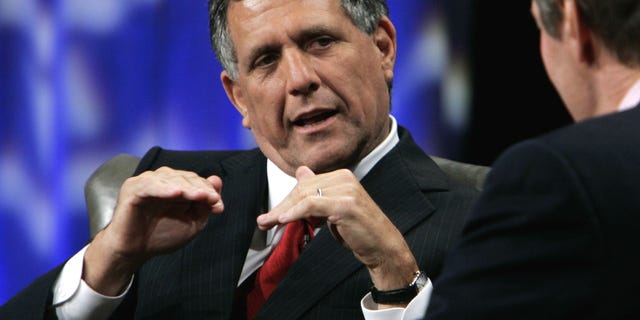 FILE -In this Tuesday, Sept. 12, 2006, file photo, Leslie Moonves, left, president and chief executive officer of CBS, talks with PBS host Charlie Rosein Beverly Hills, Calif. CEO pay has been going up, The highest paid CEO in 2012 was Leslie Moonves of CBS, who made $60.3 million. (AP Photo/Reed Saxon, File)