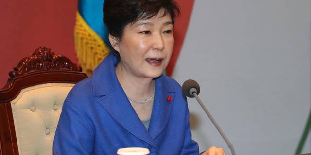 South Korean President Park Geun-hye speaks during an emergency Cabinet meeting at the presidential office in Seoul after the impeachment vote.