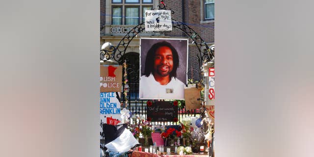 A memorial including a photo of Philando Castile adorns the gate to the Minnesota governor's residence where protesters demonstrated in St. Paul, July 25, 2016. (Associated Press)