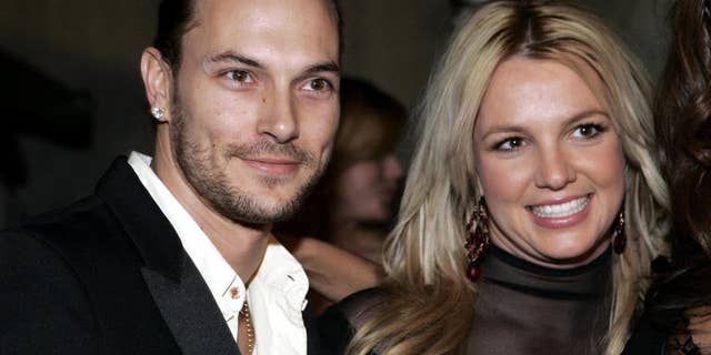 **FILE** Britney Spears, right, and her husband Kevin Federline are seen in this Feb. 8, 2006 file photo in Beverly Hills, Calif. Britney Spears' marriage to Kevin Federline officially ended Monday, July 30, 2007. "They are divorced," the pop star's attorney, Laura Wasser, said after a Superior Court hearing. "Everything is finalized." (AP Photo/Danny Moloshok, FILE)