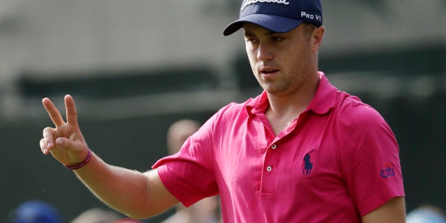 Justin Thomas celebrates after a birdie on the 13th hole during the final round of the PGA Championship golf tournament at the Quail Hollow Club Sunday, Aug. 13, 2017, in Charlotte, N.C.