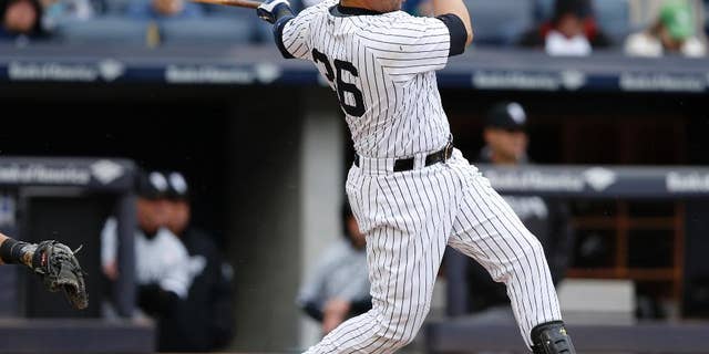 New York Yankees designated hitter Carlos Beltran hits a sixth-inning, two-run, home run in a baseball game against the Chicago White Sox in New York, Sunday, May 15, 2016. It was Beltran's 400th career home run. (AP Photo/Kathy Willens)