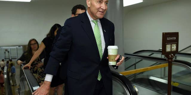 FILE -In this July 16, 2015 file photo, Sen. Charles Schumer, D-N.Y. walks on Capitol Hill in Washington. President Barack Obama suffered a temporary setback in his all-out campaign to secure Democratic support for the Iran nuclear deal as Schumer announced his opposition to the international accord. (AP Photo/Susan Walsh, File)