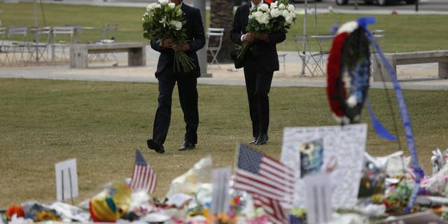President Obama and Vice President Biden arrive to place flowers at a memorial in Orlando Thursday.
