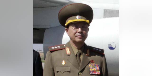 FILE - In this May 22, 2013, file photo, Ri Yong Gil, then North Korean military chief, poses for a photo before leaving Pyongyang Airport, North Korea, for China. Ri who Seoul had said was executed is actually alive and in possession of several new senior-level jobs, the North’s state media said Tuesday, May 10, 2016. The news on Ri marks yet another blunder for South Korean intelligence officials, who have often gotten information wrong in tracking developments with their rival. It also points to the difficulties that even professional spies have in figuring out what’s going on in one of the world’s most closed governments. (AP Photo/Kim Kwang Hyon, File)
