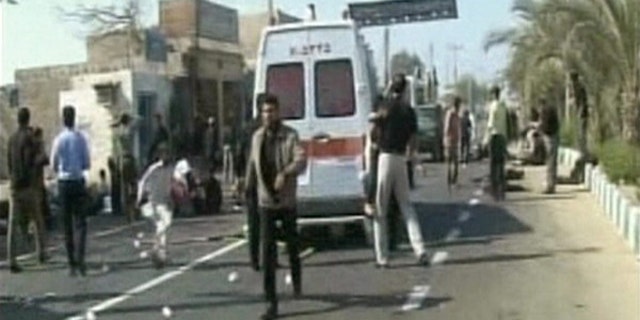 Dec. 15: The aftermath of an explosion outside a mosque in Iran's southeastern city of Chabahr is seen in this still image taken from video.