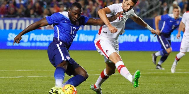 FILE - In this Friday Feb. 5, 2016, file photo, United States' Jozy Altidore, left, tries to shoot at goal as Canada's Steven Vitoria vie defends during the first half of an exhibition soccer match in Carson, Calif. Altidore appears certain to miss the Copa America Centenario following yet another hamstring injury.
Altidore, who hasn't scored for Toronto in Major League Soccer this season, got hurt Saturday, May 14, 2016, while taking a penalty kick against Vancouver that was saved. Toronto said Monday the 26-year-old will be sidelined for six-to-eight weeks. (AP Photo/Mark J. Terrill, File)
