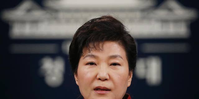 FILE - In this Jan. 13, 2016, file photo, South Korean President Park Geun-hye addresses the nation during her news conference at the Presidential Blue House in Seoul, South Korea. Upping its rhetoric a notch, North Korea warned Saturday, March 26, 2016, that it will attack Seoul’s presidential palace unless it receives an apology from South Korean President Park for “treason.” The warning is the latest threat against Washington and Seoul over joint U.S.-South Korean military drills now underway that the North sees as a dress rehearsal for invasion. (Kim Hong-ji/Pool Photo via AP, File)