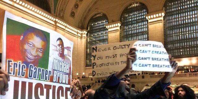 People protest in Grand Central Terminal on Wednesday, Dec. 3, 2014, in New York.