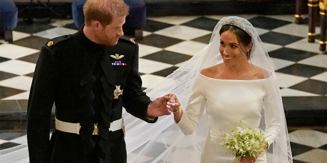Britain's Prince Harry and Meghan Markle leave after their wedding ceremony at St. George's Chapel in Windsor Castle in Windsor, near London, England on Saturday.