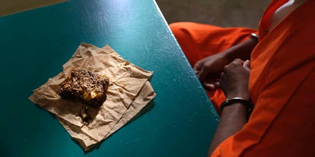 Oct. 26, 2016: A nutraloaf, a meal typically given to inmates for misbehavior involving food or bodily waste, sits in front of inmate Kevin Dickens during an interview with The Associated Press at James T. Vaughn Correctional Center in Smyrna, Del.