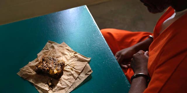 Oct. 26, 2016: A nutraloaf, a meal typically given to inmates for misbehavior involving food or bodily waste, sits in front of inmate Kevin Dickens during an interview with The Associated Press at James T. Vaughn Correctional Center in Smyrna, Del.