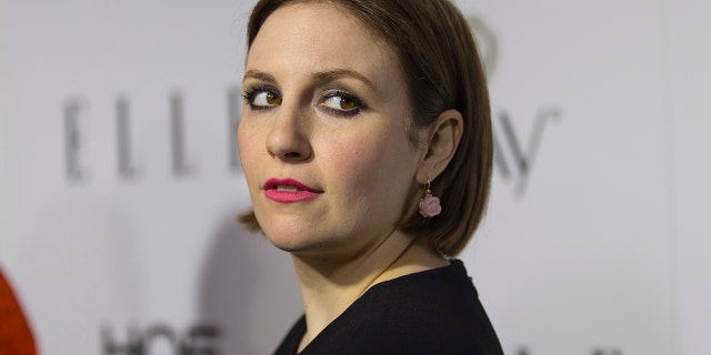 Actress Lena Dunham poses at Elle Magazine annual Women in Television dinner in Los Angeles, California January 13, 2015.