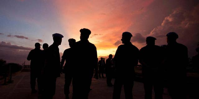 FILE - This Monday, July 11, 2011 file photo shows silhouettes of U.N. peacekeepers from Brazil at the airport in Port-au-Prince, Haiti. According to an AP investigation, some 150 allegations of abuse and exploitation were reported in Haiti between 2004 and 2016. The allegations involved U.N. peacekeepers and other personnel. Alleged victimizers came from Bangladesh, Brazil, Jordan, Nigeria, Pakistan, Uruguay and Sri Lanka, according to U.N. data and interviews. More countries may have been involved, but the United Nations only started disclosing alleged perpetrators’ nationalities after 2015. (AP Photo/Eduardo Verdugo)