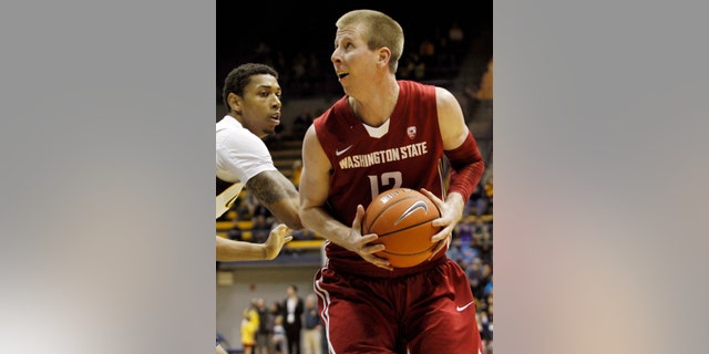 Washington State's Brock Motom, right, looks to shoot as California's Richard Solomon defends during the first half of an NCAA college basketball game, Saturday, Jan.12, 2013 in Berkeley, Calif. (AP Photo/George Nikitin)