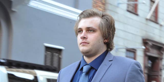 Henri Van Breda arrives at the High Court in Cape Town, South Africa, Monday, April 24, 2017. He is accused of murder of his parents and older brother in 2015. Breda pleaded not guilty to murder and to the attempted murder of his sister with an axe. (AP Photo)