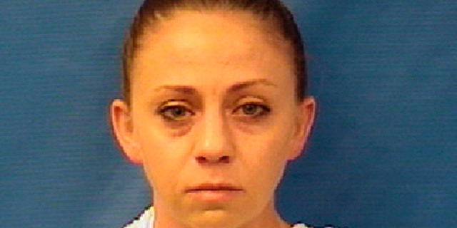 This photo provided by the Kaufman County Sheriff's Office shows Amber Renee Guyger. Guyger, a Dallas police officer, was arrested Sunday, Sept. 9, 2018, on a manslaughter warrant in the shooting of a black man at his home, Texas authorities said. The Texas Department of Public Safety said in a news release that Guyger was booked into the Kaufman County Jail and that the investigation is ongoing. It said no additional information is available at this time. (Kaufman County Sheriff's Office via AP)