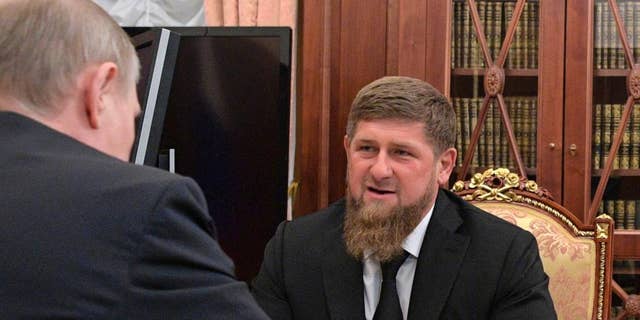 In this file photo taken Wednesday, April 19, 2017, Russian President Vladimir Putin, left, meets with Chechnya's regional leader Ramzan Kadyrov in the Kremlin in Moscow, Russia. 