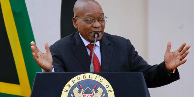 FILE -- In this Oct. 11, 2016, file photo, South African President Jacob Zuma gives a press conference at State House in Nairobi, Kenya. The head of South Africa’s state watchdog agency says she is delaying the release of a report on whether a wealthy business family linked to President Jacob Zuma sought to influence Cabinet minister appointments. (AP Photo/Khalil Senosi, File)