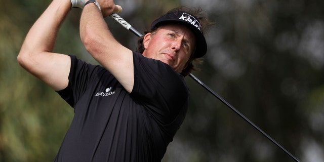 Phil Mickelson of the U.S. tees off on the 5th hole during the final round of the Abu Dhabi HSBC Golf Championship in Abu Dhabi, United Arab Emirates, Sunday Jan. 19, 2014. (AP Photo/Kamran Jebreili)