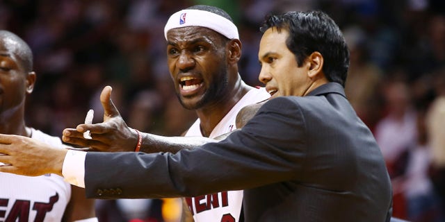 Miami Heat coach Erik Spoelstra, right, and LeBron James protest a loose ball foul called against James during the second half of an NBA basketball game against the Los Angeles Clippers in Miami, Thursday, Nov. 7, 2013. The Heat won 102-97. (AP Photo/J Pat Carter)