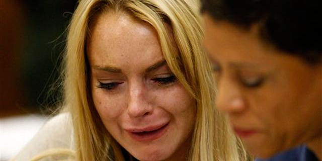 July 6: Lindsay Lohan tearfully reacts as a L.A. judge sentences her to 90 days in jail and 90 in an in-patient rehab facility.