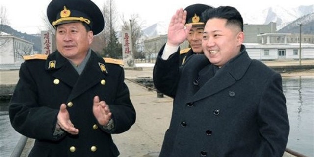 Feb. 7, 2012: North Korean leader Kim Jong Un, right, salutes when he visited Unit 158 of the navy of the North Korean People's Army.