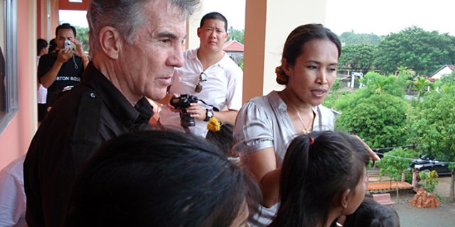 John Walsh and child rescuer Somaly Mam. (FOX/AMW)