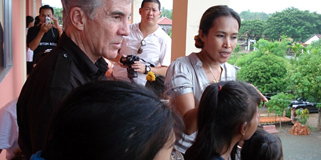 John Walsh and child rescuer Somaly Mam. (FOX/AMW)