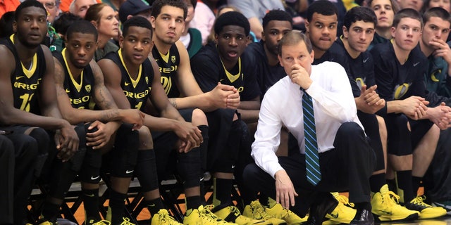 Oregon head coach Dana Altman and the bench watch as the Oregon State take a double-digit lead during an NCAA men's basketball game at Gill Coliseum in Corvallis, Ore. on Sunday, Jan. 19, 2014. Oregon lost 80-72 to Oregon State. (AP Photo/The Register-Guard, Brian Davies)