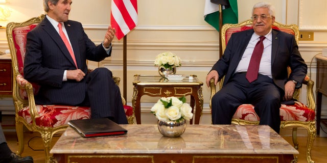 US Secretary of State John Kerry, left, meets with Palestinian President Mahmoud Abbas about ongoing peace talks with Israel on Wednesday, Feb. 19, 2014, in Paris. U.S. Secretary of State John Kerry is in Paris for talks aimed at reaching agreement on a framework for an Israeli-Palestinian peace deal. Kerry met Wednesday with Jordanian Foreign Minister Nasser Judeh and Palestinian President Mahmoud Abbas, with the aim of working to define the framework for negotiators as they seek to forge a comprehensive settlement to the conflict. (AP Photo/ Evan Vucci, Pool)
