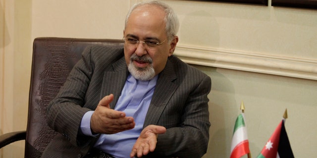 Iranian Foreign Minister Mohammad Javad Zarif meets with his Jordanian counterpart Nasser Judeh in Amman, Jordan, Tuesday, Jan. 14, 2014. Zarif visits Jordan as part of his regional tour of the Middle East countries including Iraq, Kuwait, Lebanon, Oman, Qatar and United Arab Emirates. (AP Photo/Mohammad Hannon, Pool)
