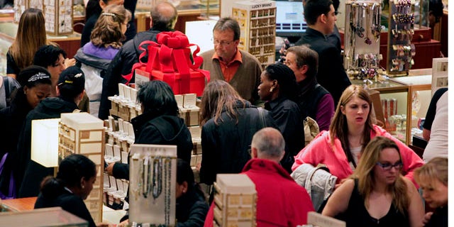 Macy's aisles are crowded with shoppers on Black Friday called that because the surge of shoppers could take retailers into profitability, on Friday, Nov. 26, 2010, in Manhattan, New York. (AP Photo/Bebeto Matthews)
