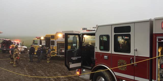 The boy was stuck in a manure pit an official described as "kind of like quicksand."