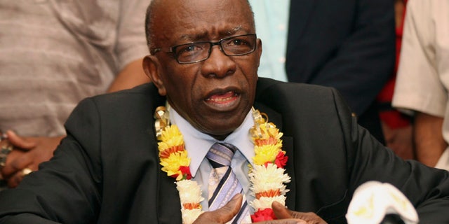 In this Thursday, June 2, 2011 file photo, suspended FIFA executive Jack Warner gestures during a news conference held shortly after his arrival at the airport in Port-of-Spain, in his native Trinidad and Tobago.