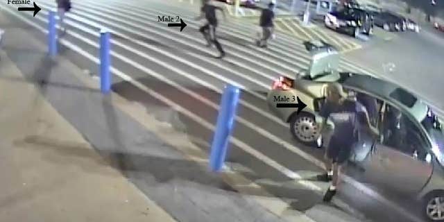 Police said surveillance footage captured the female, who's now "safe and unharmed," escaping the vehicle and running away from a group of men, who seemingly forced her back into the car.