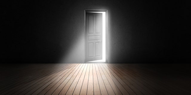 Open door into the darkness.