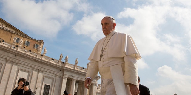 Pope Francis arrives for his weekly general audience in St. Peter's Square at the Vatican, Wednesday, April 29, 2015. (AP Photo/Alessandra Tarantino)