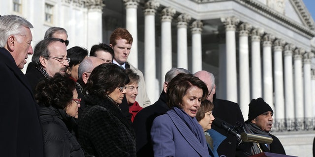 WASHINGTON, DC - FEBRUARY 13:  House Minority Leader Nancy Pelosi (D-CA), joined by other members of the House Democratic caucus, speaks during a news conference on the steps of the U.S. Capitol February 13, 2015 in Washington, DC. House Democrats held the news conference to call on House Republicans to pass a "clean" funding bill for the Department of Homeland Security. (Photo by Win McNamee/Getty Images)
