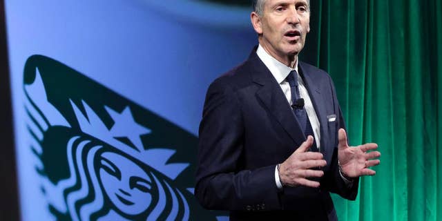 FILE- In this Dec. 7, 2016, file photo, Starbucks Chairman and CEO Howard Schultz speaks during the Starbucks 2016 Investor Day meeting in New York. Starbucks says it will hire 10,000 refugees over the next five years, a response to President Donald Trump's indefinite suspension of Syrian refugees and temporary travel bans that apply to six other Muslim-majority nations. Schultz said in a letter to employees Sunday, Jan. 29, 2017, that the hiring would apply to stores worldwide. (AP Photo/Richard Drew, File)