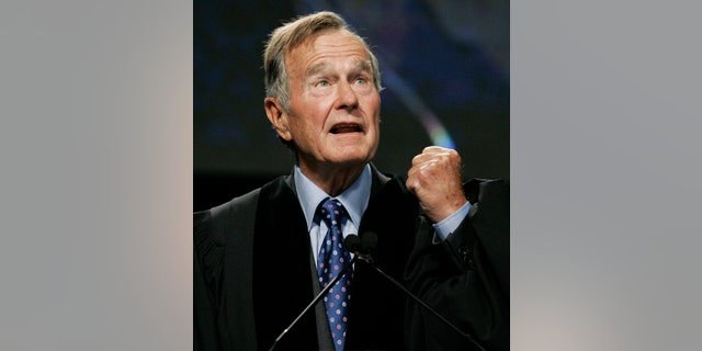 FILE - In this Sept. 21, 2006 file photo, former President George H.W. Bush delivers the keynote speech before receiving an honorary Doctor of Public Administration degree at Suffolk University in Boston. A spokesman says Bush's condition continues to improve and that he was moved Saturday, Dec. 29, 2012, out of intensive care and into a regular hospital room. (AP Photo/Elise Amendola, Pool, File)