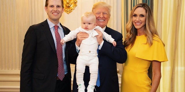 Lara Trump is seen here with her husband Eric Trump, son Luke, and her father-in-law, President Donald Trump.