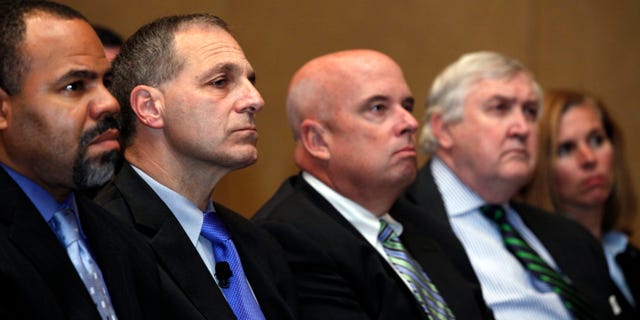 November 21: Former FBI director Louis Freeh, second from left, listens during a press availability to announce he will lead an independent investigation into allegations of child abuse by a former Penn State employee.