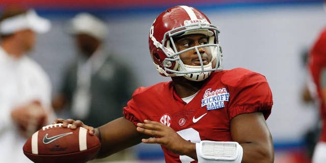 Alabama quarterback Blake Sims (6) warms up before an NCAA college football game against West Virginia Saturday, Aug. 30, 2014, in Atlanta. (AP Photo/John Bazemore)
