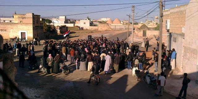 Nov. 6, 2011: In this citizen journalist's image made with a mobile phone and provided by Shaam News Network, Syrian protesters stage a demonstration against the Syrian President Bashar Assad's regime at Mreidekh village in Edlib province, northern Syria, according to the source.