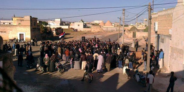 Nov. 6, 2011: In this citizen journalist's image made with a mobile phone and provided by Shaam News Network, Syrian protesters stage a demonstration against the Syrian President Bashar Assad's regime at Mreidekh village in Edlib province, northern Syria, according to the source.