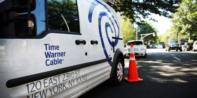 NEW YORK, NY - AUGUST 27: A Time Warner Cable truck is viewed in Brooklyn on August 27, 2014 in New York City. Time Warner Cable, which has 11.4 million subscribers in the United States, suffered a massive power outage Wednesday morning across the nation. While customers appeared to have power back by mid-morning, thousands had lost internet service for the duration of the outage. In a deal that is valued at $45.2 billion, Time Warner Cable is attempting to merge with Comcast. (Photo by Spencer Platt/Getty Images)