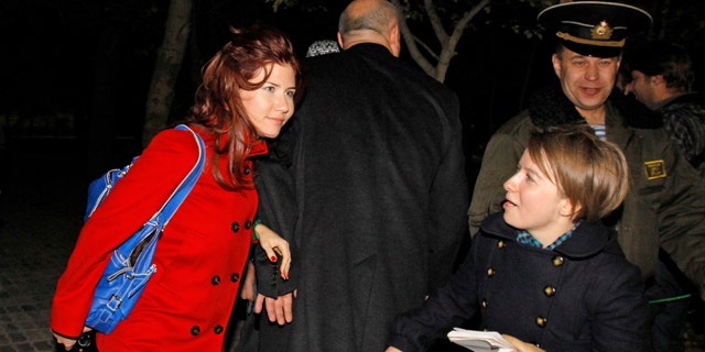 Oct. 7, 2010: Anna Chapman, left, a Russian national who was deported from the U.S. this summer for alleged spying for Russia, with AP reporter Nataliya Vasilyeva at the farewell ceremony for a U.S. astronaut and two Russian cosmonauts at the Russian leased Baikonur cosmodrome, Kazakhstan.